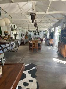 a large room with tables and chairs in it at Die Olyfhuis in Barkly West