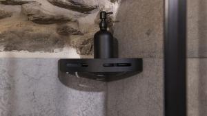 a black light attached to a stone wall at Chalet Ferrari in Ponte di Legno