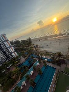 an aerial view of a resort with a beach at Ecosea Timurbay in Kampong Tanjong