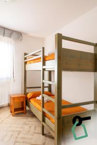two bunk beds in a room with a green number zero at Hotiday Gallipoli Masseria in Gallipoli