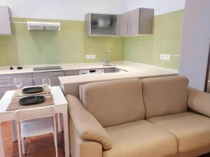 a living room with a couch and a table at Garro1 in Pasajes Ancho