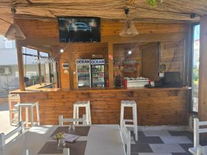 a restaurant with a table and chairs in a building at Hotel Bar Pizzeria Verona in Ksamil