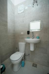 a bathroom with a toilet and a sink at Castle hostel in Cairo +74 photos