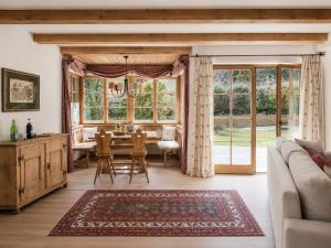 a living room with a table and a dining room at Chalet Lebenberg Kitzbühel in Kitzbühel