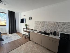 a kitchen with a sink and a counter top at Castle View Apartments in Făgăraş