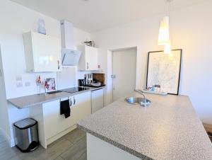 a kitchen with a sink and a counter top at New Barnet Fresh Apartment in New Barnet
