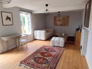 a living room with a couch and a rug at Pallancheloc in Amions