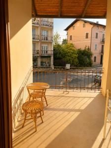 a patio with a table and a chair on a balcony at Charm Studio - Large private terrace, Masserano in Masserano