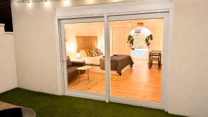 a room with a bed and a living room at 16 Casita con Jacuzzi privado in Gran Alacant