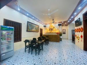 a dining room with a table and chairs at Tam Coc Harmony Homestay in Vũ Lâm