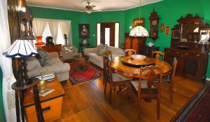 a living room with a table and a couch at Beau & I in Graaff-Reinet +20 photos