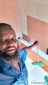 a man with a beard holding a toothbrush at Bafadhil vacation home in Kilifi