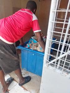 a man is looking into a blue box at Bafadhil vacation home in Kilifi