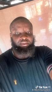 a man with a beard is looking at the camera at Bafadhil vacation home in Kilifi