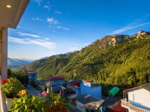 a view of a small town in the mountains at Cloud House Sapa in Sapa