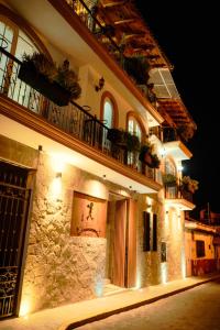 a building at night with lights on it at Hotel el Leñador in Mazamitla