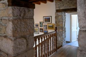 a hallway in a castle with a stone wall at Gîte à l'origine in Montgesoye