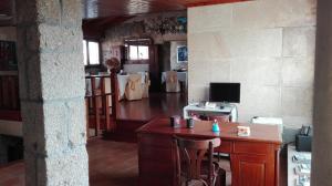 TV a/nebo společenská místnost v ubytování Casa Cruceiro