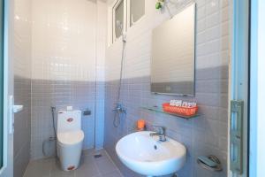 a bathroom with a sink and a toilet at Villa Tuan Vu Da Lat in Da Lat +23 photos