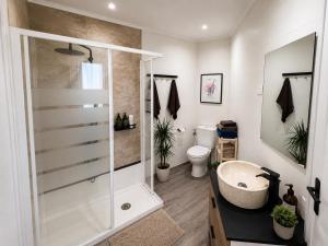 a bathroom with a shower and a sink at Hauda in Sopelana +36 photos
