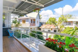 a balcony with a view of a house at Villa Tuan Vu Da Lat in Da Lat