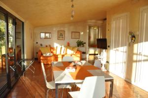 a living room with a table and a couch at Suite Prestige Salerno in Salerno