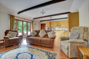 a living room with a couch and two chairs at 2 Bed in Lyng oc-864 in Lyng