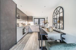a kitchen with a table and some chairs in it at 3 Bed in Looe oc-j29456 in Looe