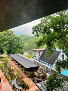 an overhead view of a house with a swimming pool at Ark Pai in Pai