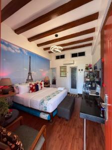 a bedroom with a bed and a view of the eiffel tower at Italy Condotel Darasa in Tanauan