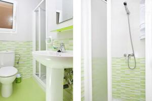 two pictures of a bathroom with a sink and a toilet at Casa Lenore in El Cabo de Gata