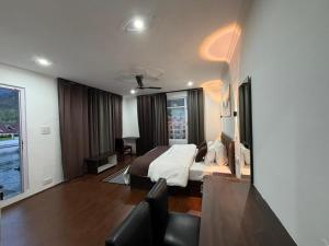 a hotel room with a bed and a living room at FarahBakshResidency in Srinagar