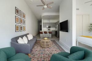 a living room with a couch and a bed at South Downtown Condo no.308 in Dallas +18 photos
