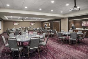 a conference room with tables and chairs in it at Courtyard by Marriott Wayne Fairfield in Wayne