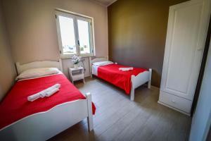A bed or beds in a room at Marina di Rossano Village Club