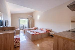 a living room with a couch and a table at Villa Petra in Neum