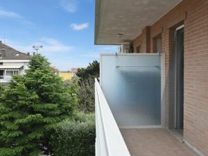 a gray garage door on the side of a building at SE251 - Marzocca, quadrilocale comodo al mare e ai servizi in Marzocca di Senigallia