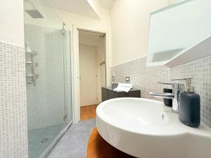 a white bathroom with a sink and a shower at SE251 - Marzocca, quadrilocale comodo al mare e ai servizi in Marzocca di Senigallia +27 photos