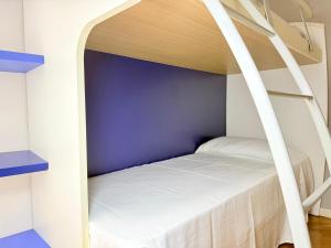 a bedroom with a bunk bed with a ladder at SE251 - Marzocca, quadrilocale comodo al mare e ai servizi in Marzocca di Senigallia