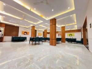a large banquet hall with tables and chairs at Vantara Gir Resort in Sasan Gir