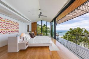 a bedroom with a bed and a large window at The View in Taling Ngam Beach +36 photos