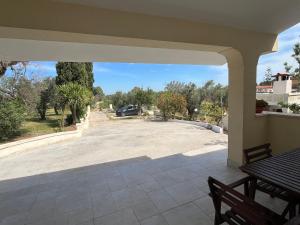 a patio with a view of a parking lot at Villa Mina in Serranova