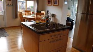 a kitchen with an island with a counter top at 4 Meadow View in Woolacombe