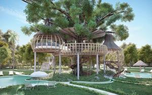 a resort with a tree house and a swimming pool at Casa Maya in Puerto Morelos