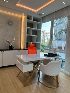 an office with a desk and chairs and a window at IP on HOME 1 in Jomtien Beach