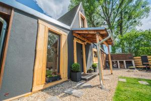 a tiny house being constructed with the door open at Chata Björk in Babice +43 photos