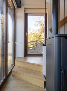 a kitchen with a door leading to a porch at Benaki 99 in Ladines