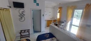 a living room with a window and a table and a chair at Villa Flavia - Adults Only in Ponza +68 photos