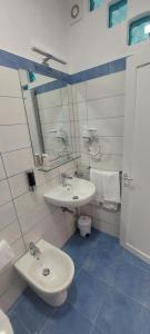 a bathroom with a sink and a toilet at Villa Flavia - Adults Only in Ponza