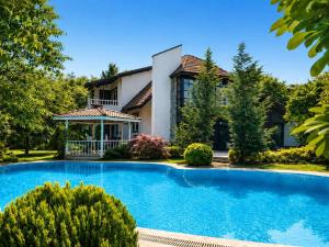 a house with a swimming pool in front of a house at Kartepe Mountain Villa in Kartepe +32 photos